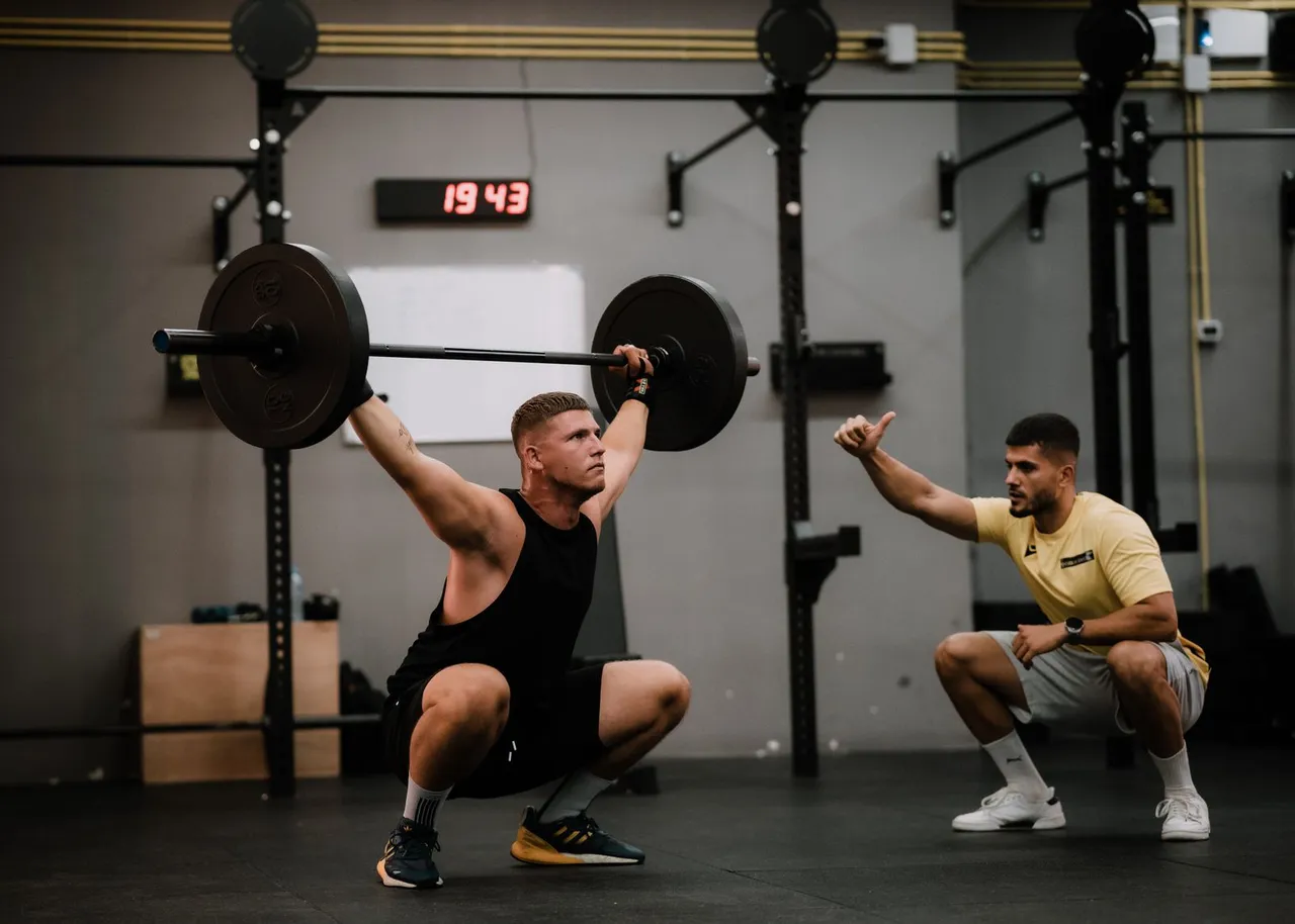 A lifter training with a heavy loaded barbell